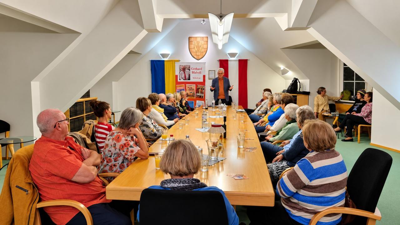 Foto: Der Autor und die Zuhörer im Gemeindehaus Reisenberg